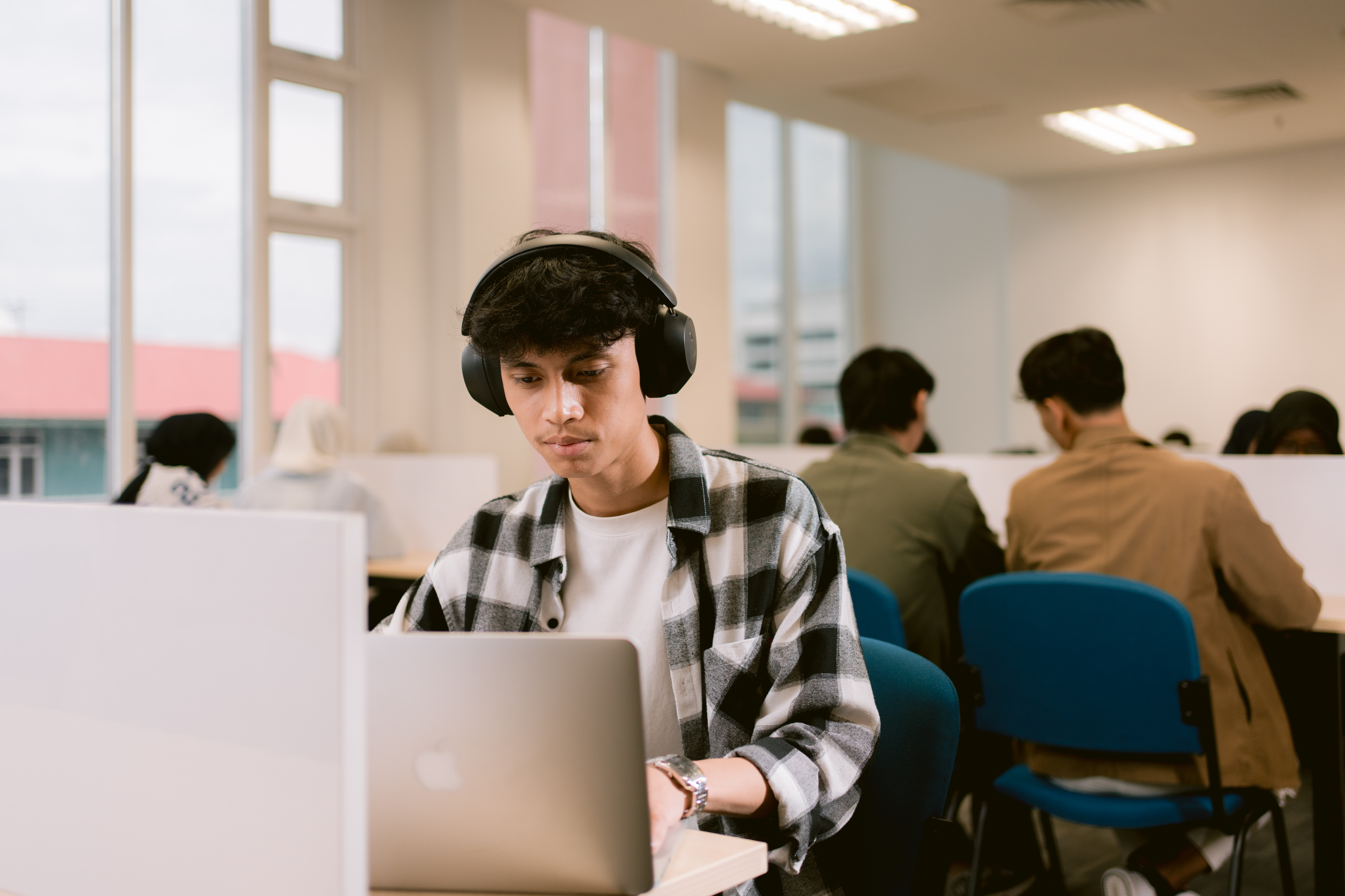Students reading and learning in a library